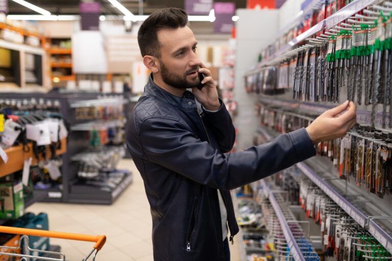 customer in a tool store choosing drill bits